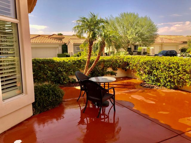 a view of a terrace with chairs