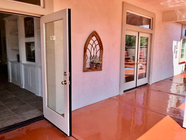 a view of front door with wooden floor