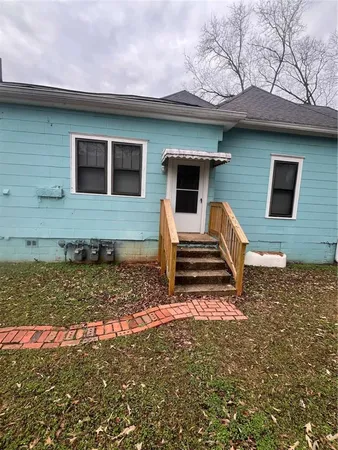 a house with a tree in front of it