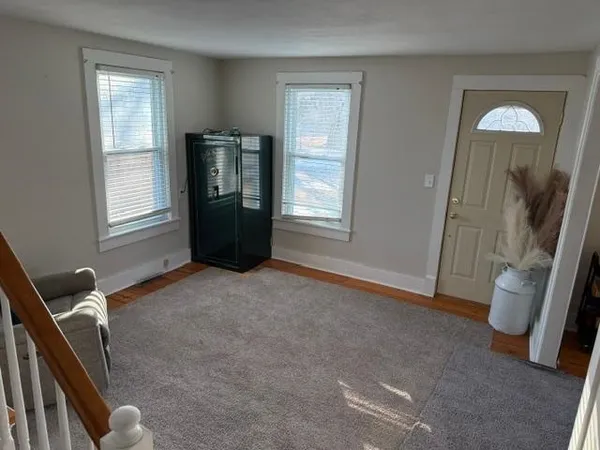 a kitchen with a refrigerator and a sink