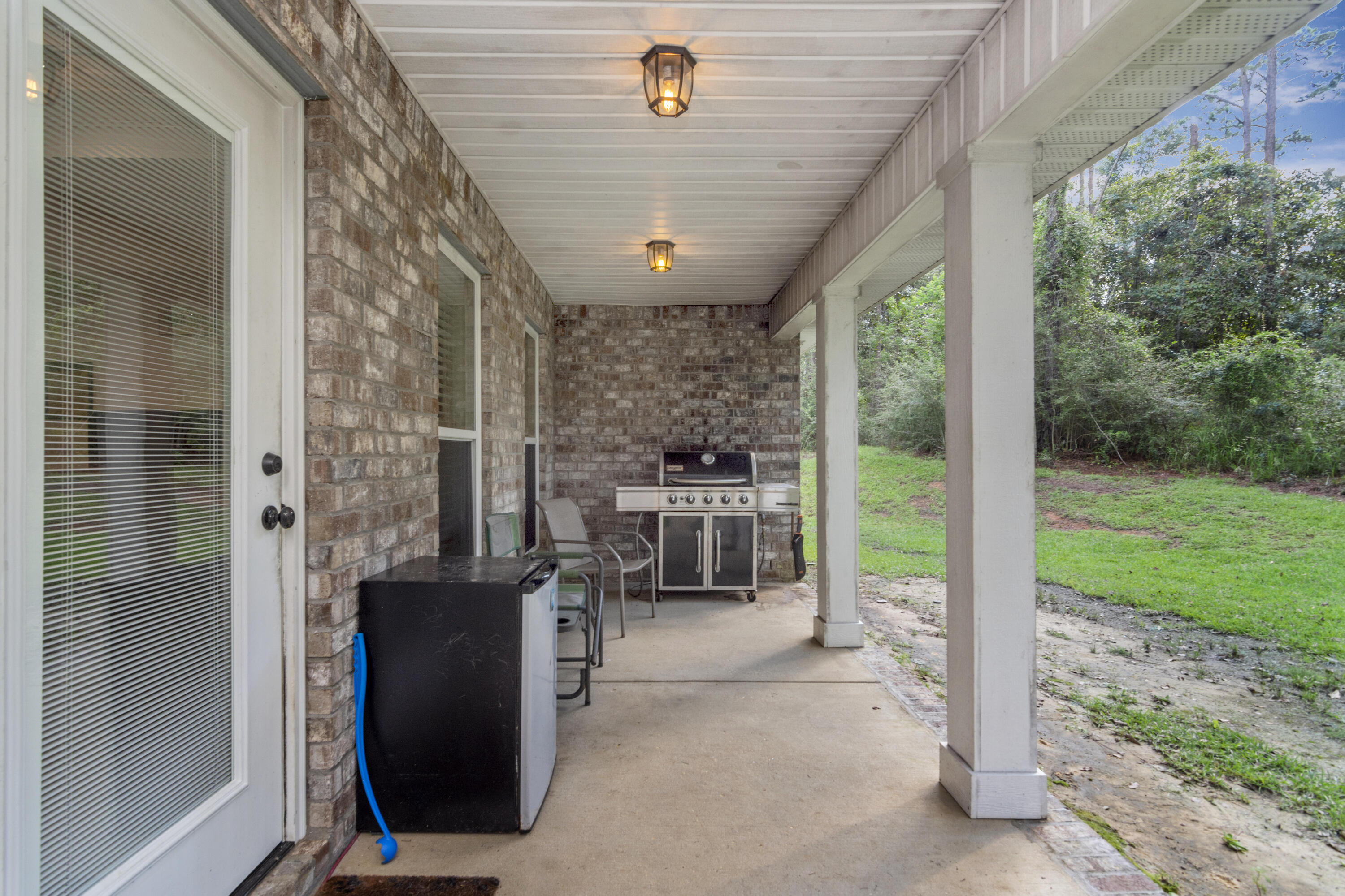 5822 Dairy Road Baker, FL 32531 - Photo 40 of 47 a view of a living room and a balcony