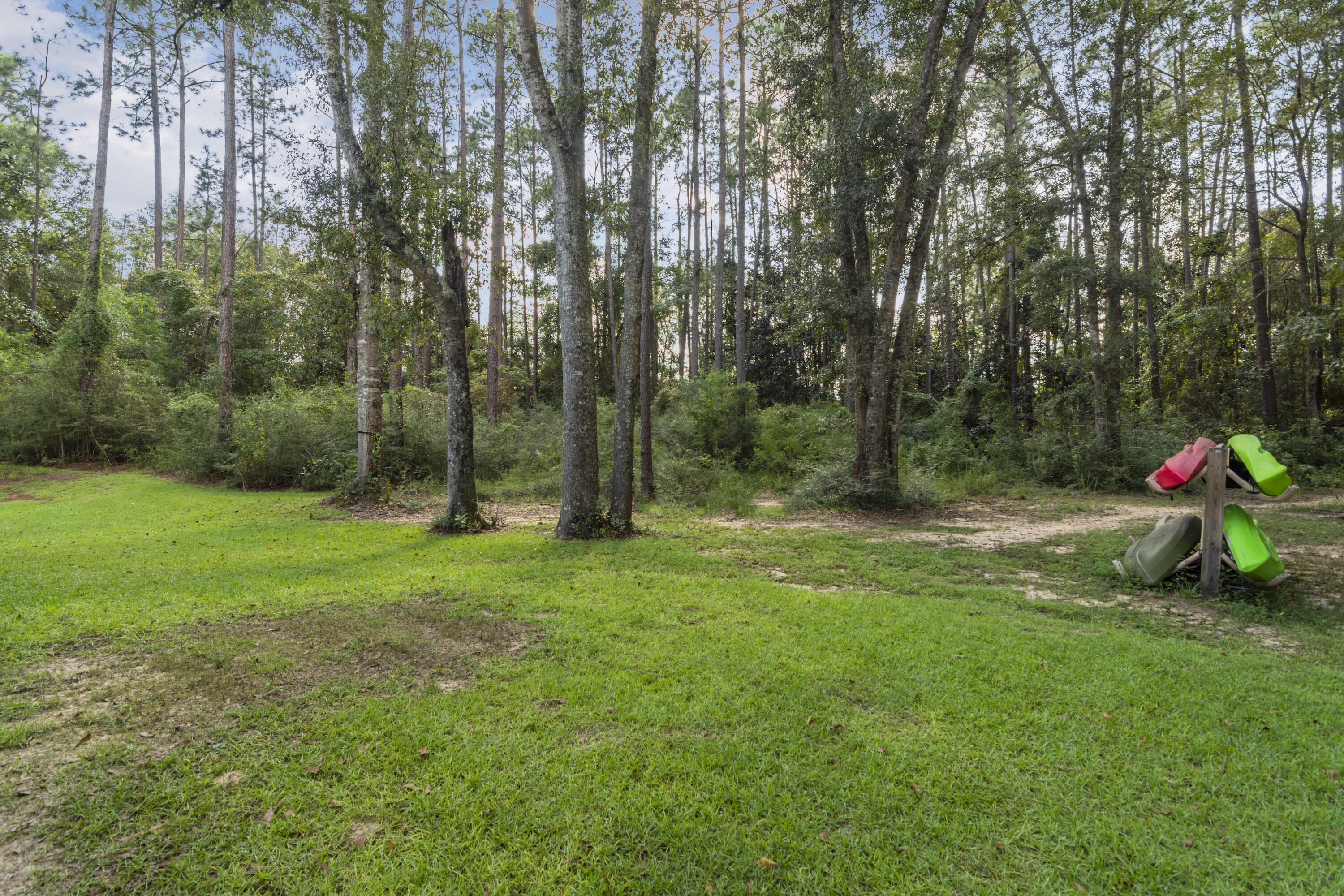 5822 Dairy Road Baker, FL 32531 - Photo 41 of 47 a childrens park with lots of trees and slides