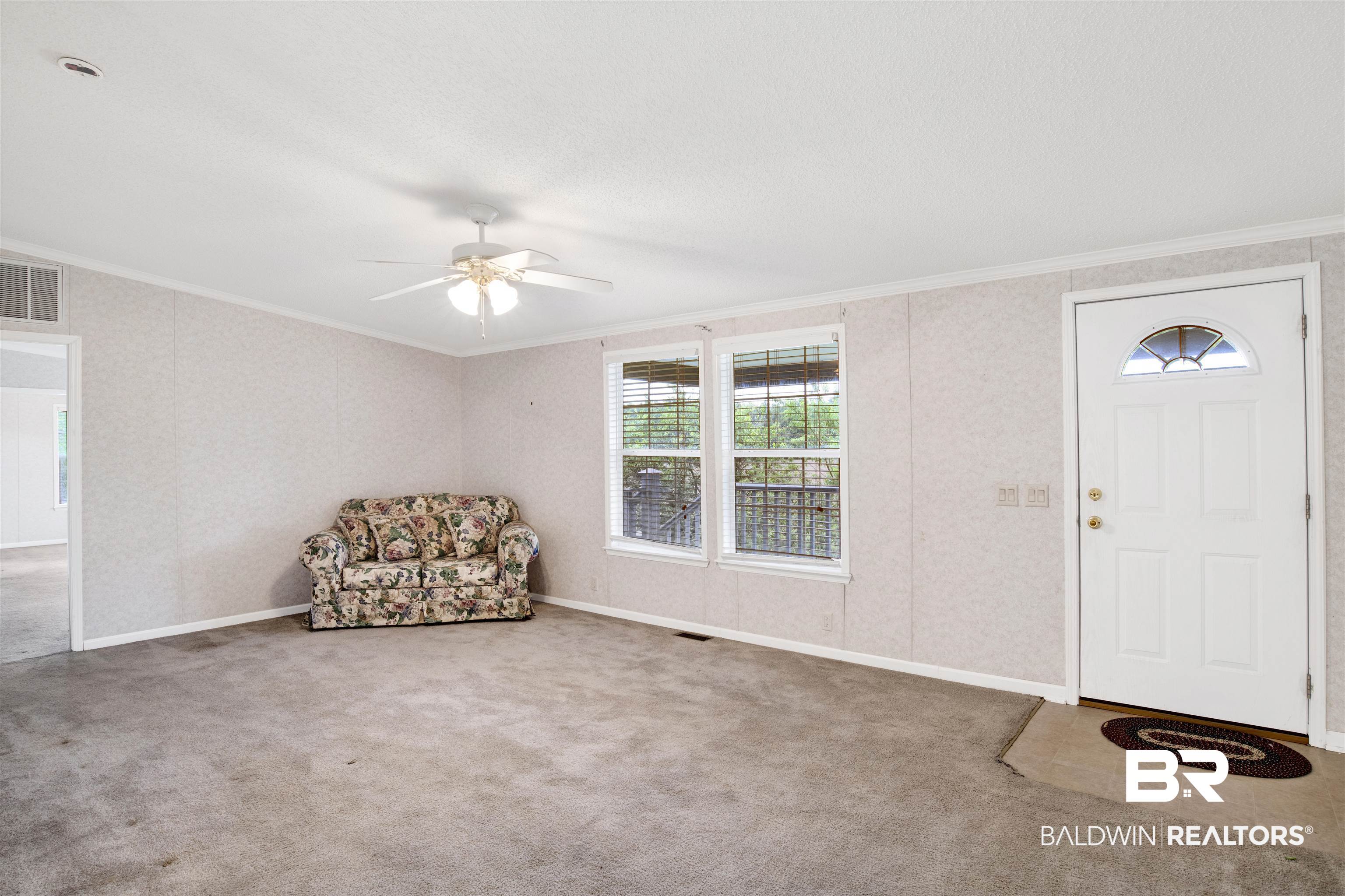 25700 County Road 71 Robertsdale, AL 36567 - Photo 4 of 40 Entrance foyer with crown molding, ceiling fan, and carpet flooring