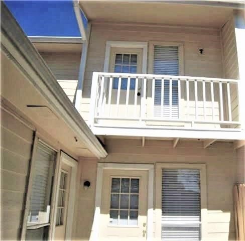 14020 Schroeder Road, Unit 151 Houston, TX 77070 - Photo 23 of 26 a front view of a building with a porch