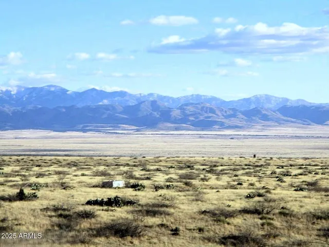 a view of a large body of water with a mountain in the background