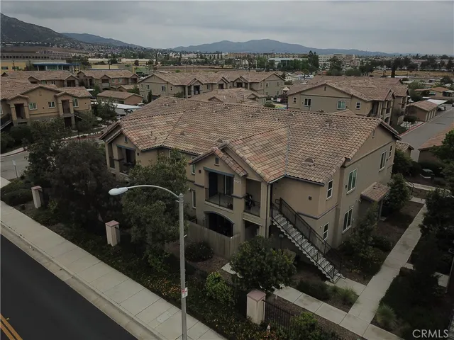 a sign board with a yard of the house