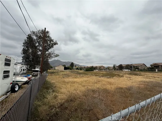 a view of a lake with houses in the back