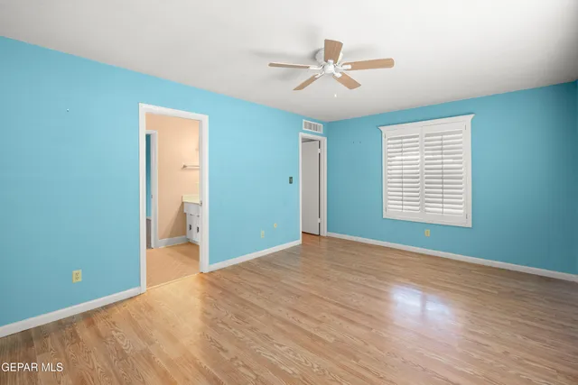 a outdoor space with the couches and dining table with the garden view