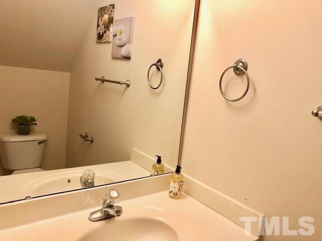 9810 Raleigh, NC 27617 - Photo 13 of 26 a bathroom with a granite countertop bathtub and a sink