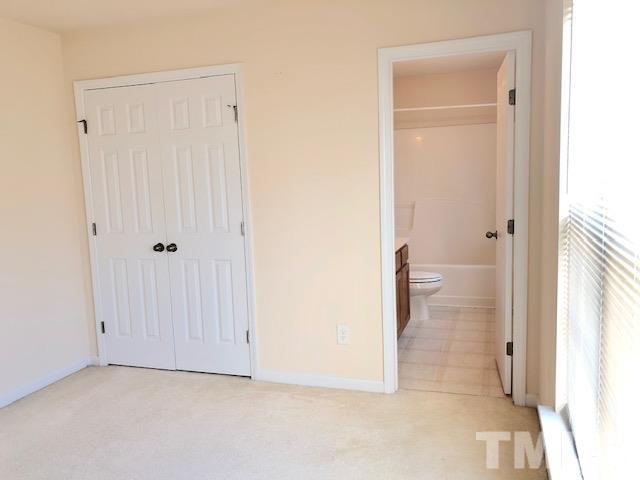 9810 Raleigh, NC 27617 - Photo 16 of 26 a view of a bathroom with a toilet