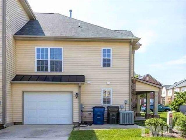 9810 Raleigh, NC 27617 - Photo 26 of 26 a view of a house with couches chairs and a yard