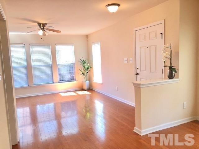 9810 Raleigh, NC 27617 - Photo 4 of 26 a view of a livingroom with wooden floor and a window