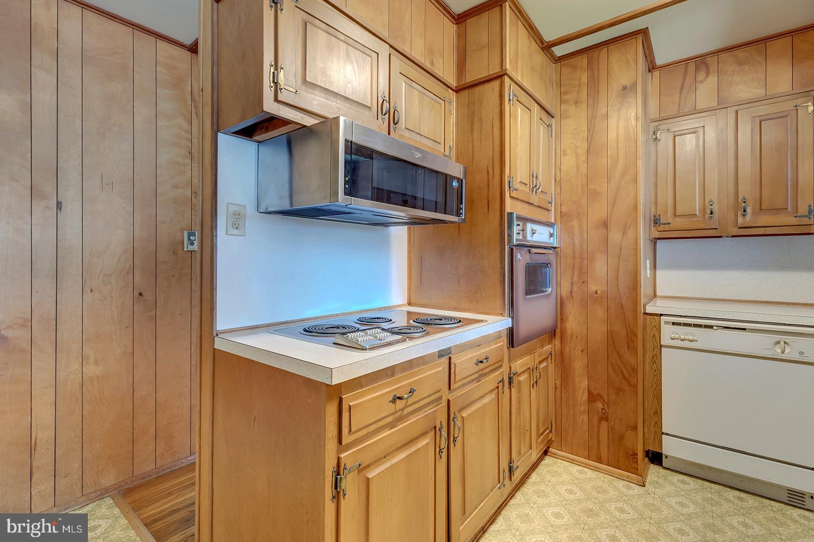 57 Plain Dealing Road Magnolia, DE 19962 - Photo 12 of 64 a kitchen with stainless steel appliances granite countertop a refrigerator and a stove