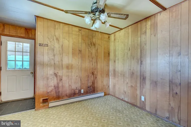 a kitchen with granite countertop cabinets stainless steel appliances and a window