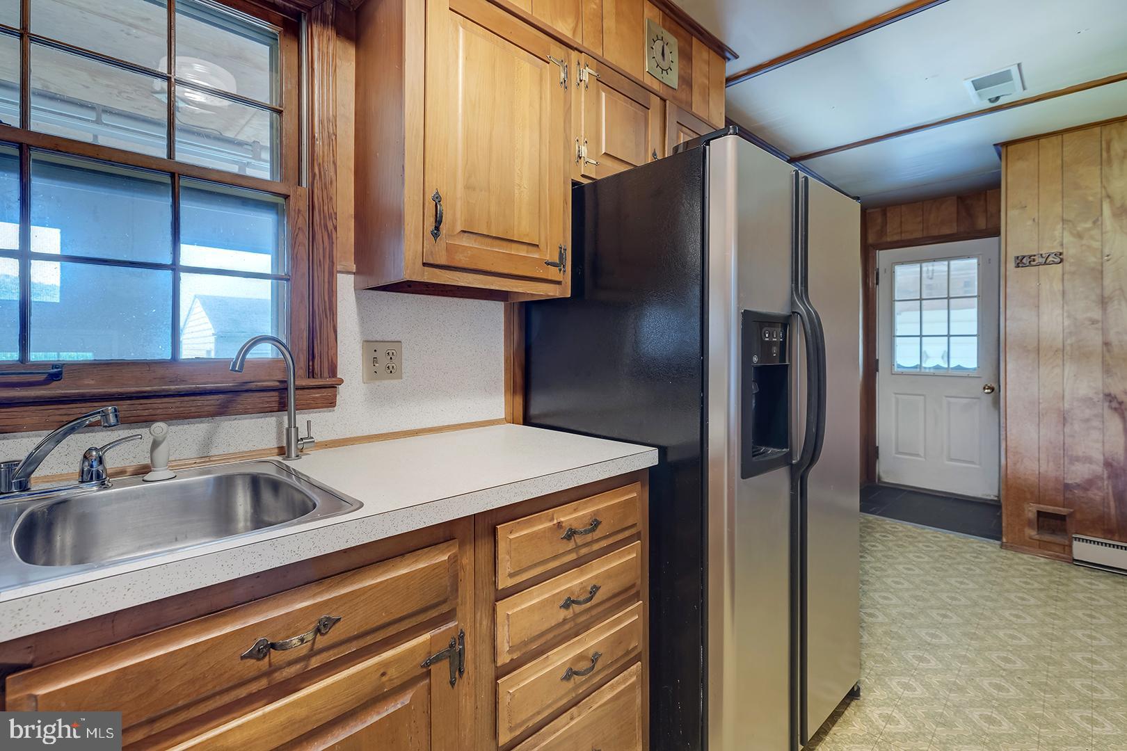 57 Plain Dealing Road Magnolia, DE 19962 - Photo 15 of 64 a kitchen with stainless steel appliances granite countertop a refrigerator and a sink