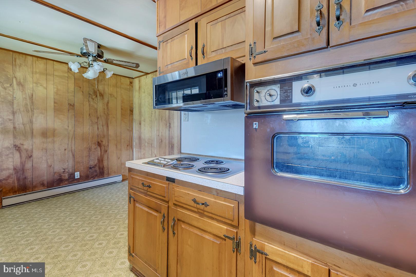 57 Plain Dealing Road Magnolia, DE 19962 - Photo 16 of 64 a kitchen with stainless steel appliances granite countertop a stove and a microwave