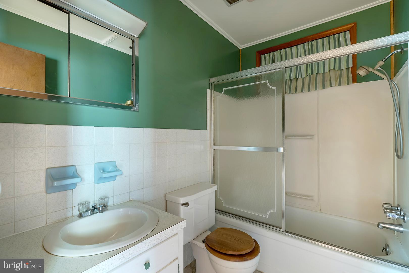 57 Plain Dealing Road Magnolia, DE 19962 - Photo 17 of 64 a bathroom with a sink a toilet and shower