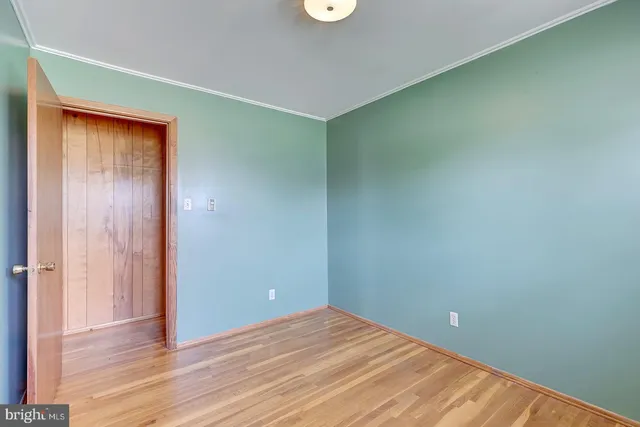 a view of workspace with wooden floor and windows
