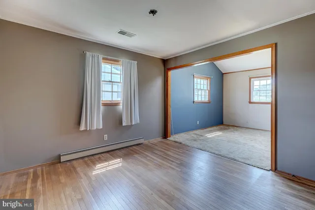 an empty room with windows