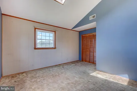 a view of an empty room with windows