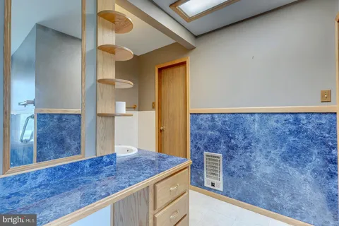 a kitchen with a table and chairs in it