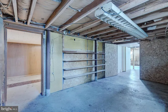 an aerial view of a house with a yard and lake view
