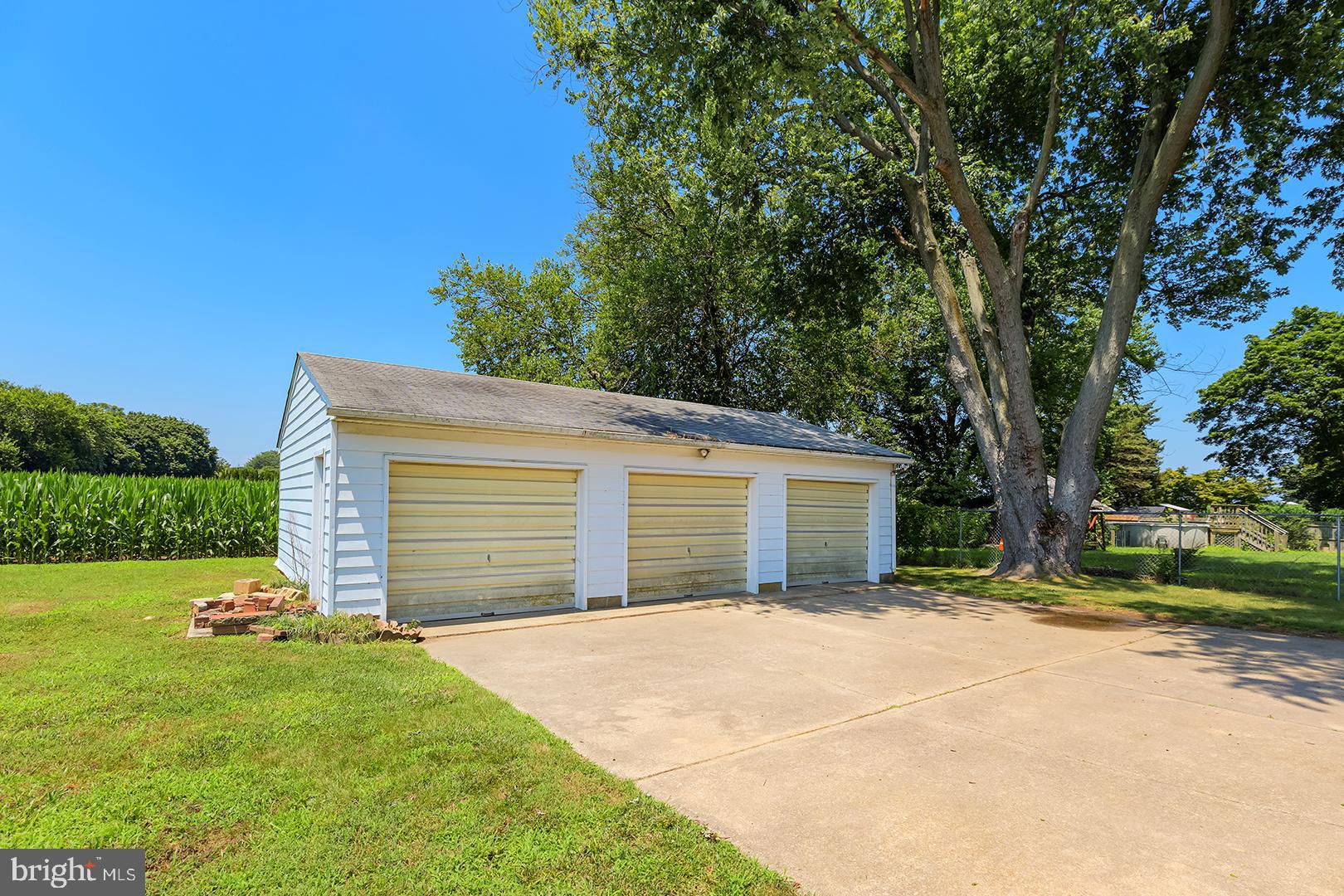 57 Plain Dealing Road Magnolia, DE 19962 - Photo 50 of 64 a front view of a house with a yard and garage