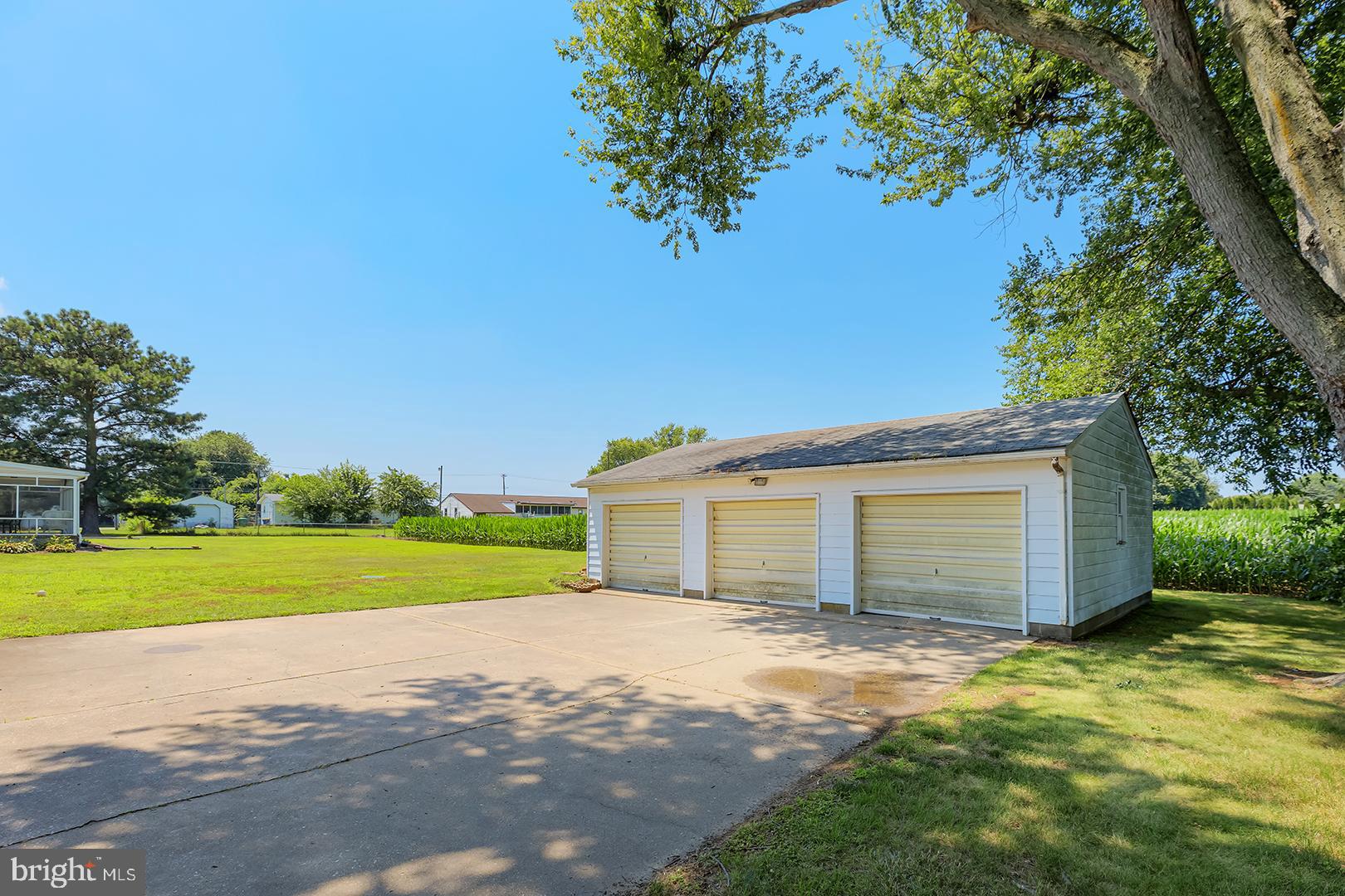 57 Plain Dealing Road Magnolia, DE 19962 - Photo 52 of 64 a view of a house with a yard and garage