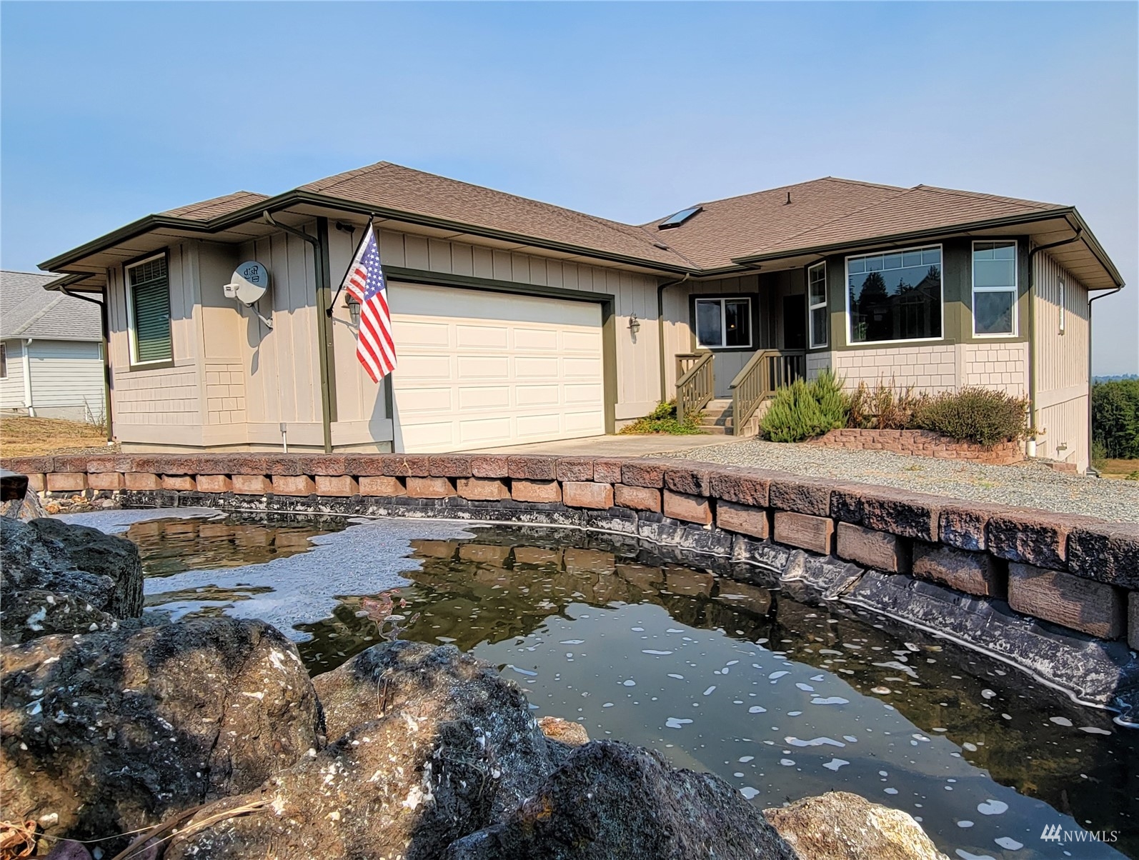 131 Les Saints Road Sequim, WA 98382 - Photo 1 of 32 a front view of a house with a yard