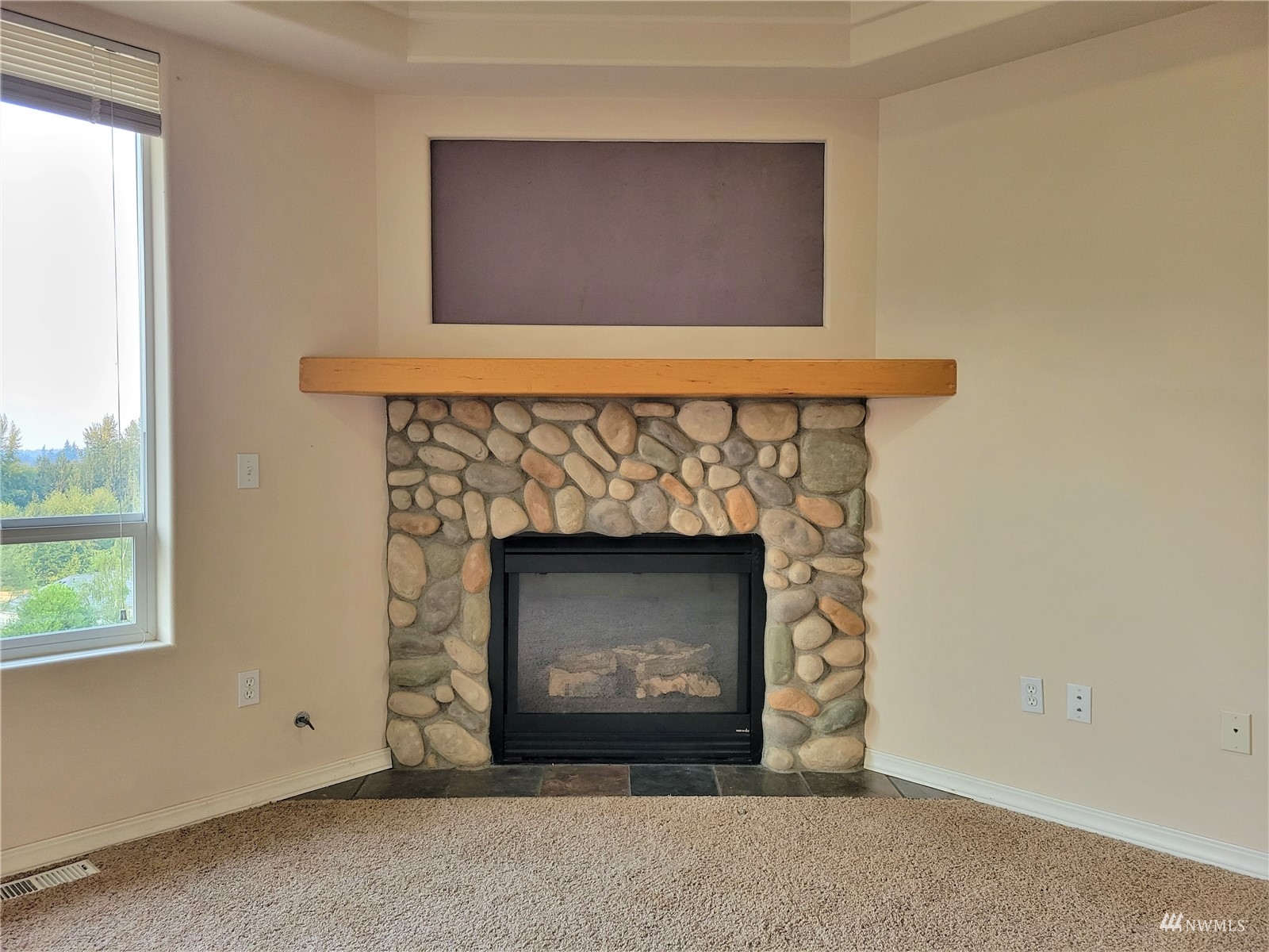 131 Les Saints Road Sequim, WA 98382 - Photo 14 of 32 a view of an empty room with a fireplace