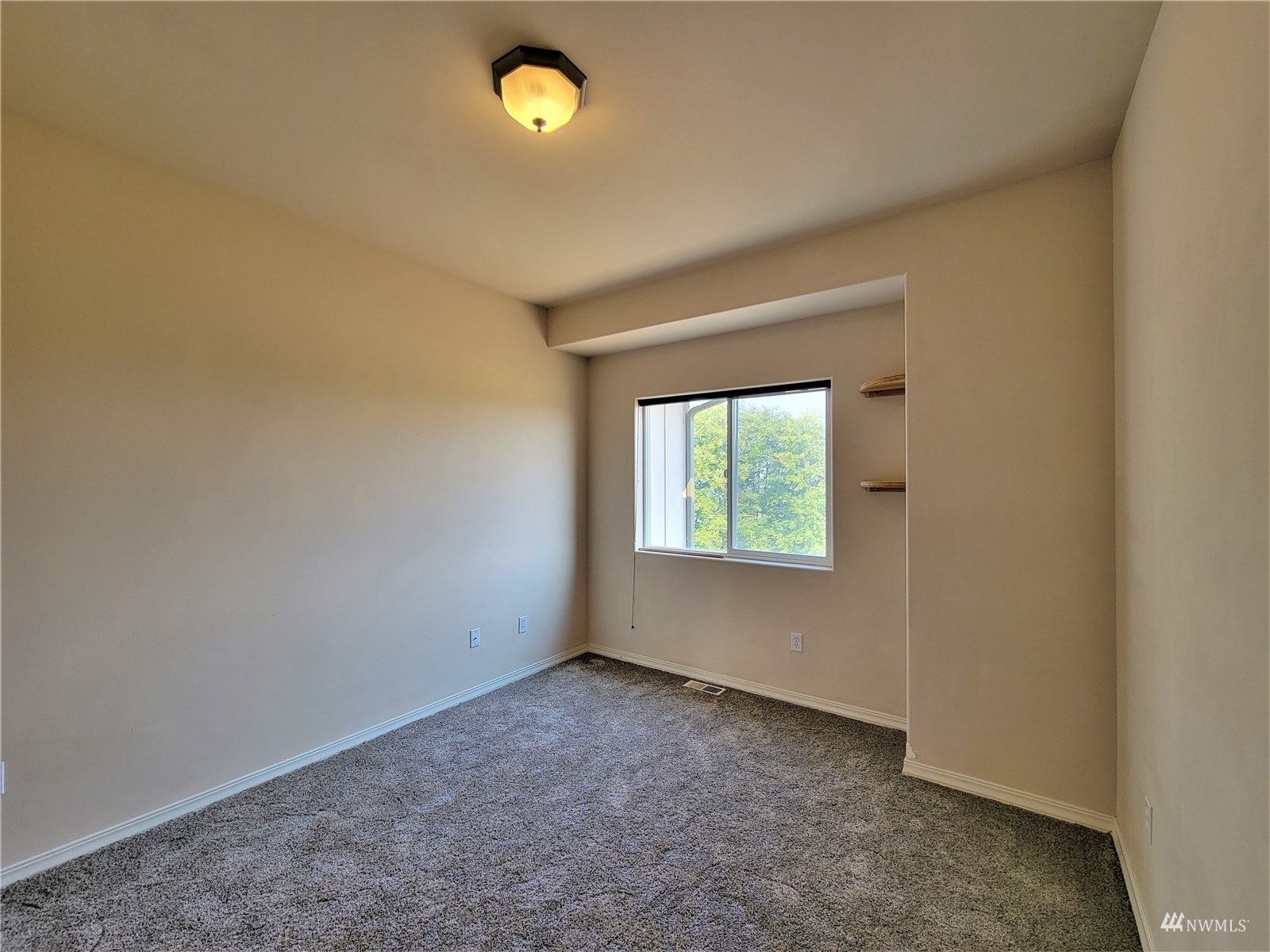 131 Les Saints Road Sequim, WA 98382 - Photo 16 of 32 an empty room with a empty space and a window