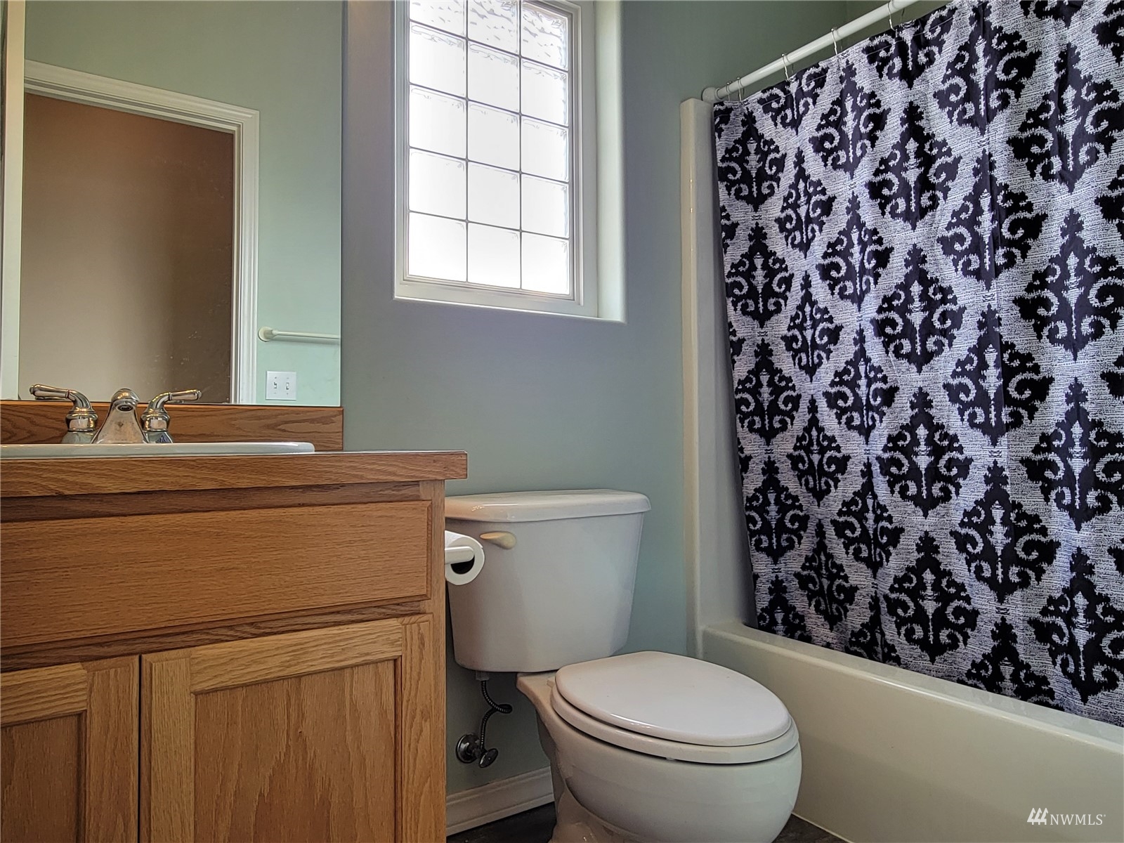 131 Les Saints Road Sequim, WA 98382 - Photo 18 of 32 a bathroom with a toilet and a sink