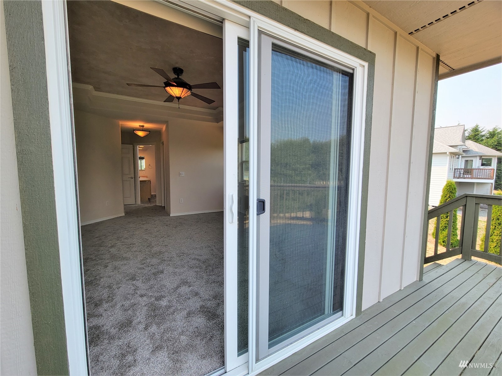 131 Les Saints Road Sequim, WA 98382 - Photo 25 of 32 a view of a hallway with wooden floor and staircase