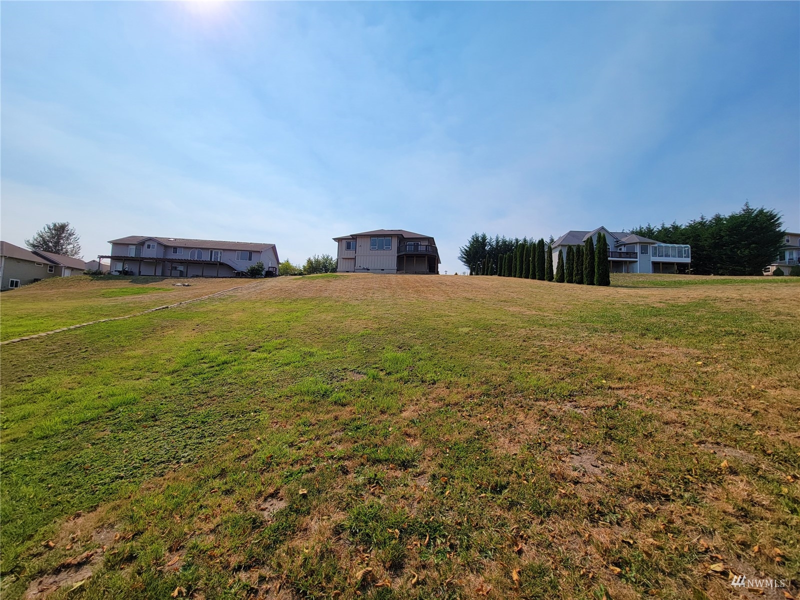 131 Les Saints Road Sequim, WA 98382 - Photo 31 of 32 a big yard with an ocean view