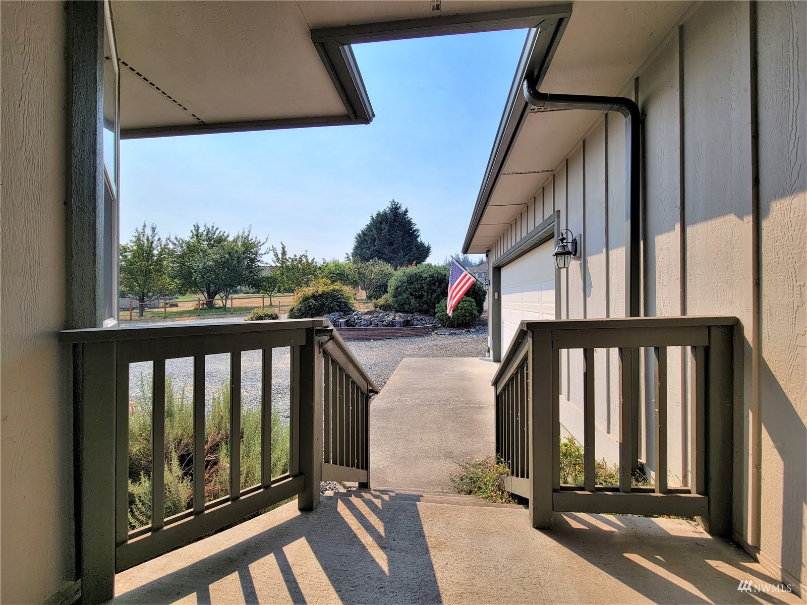 131 Les Saints Road Sequim, WA 98382 - Photo 5 of 32 a view of balcony with wooden floor and fence