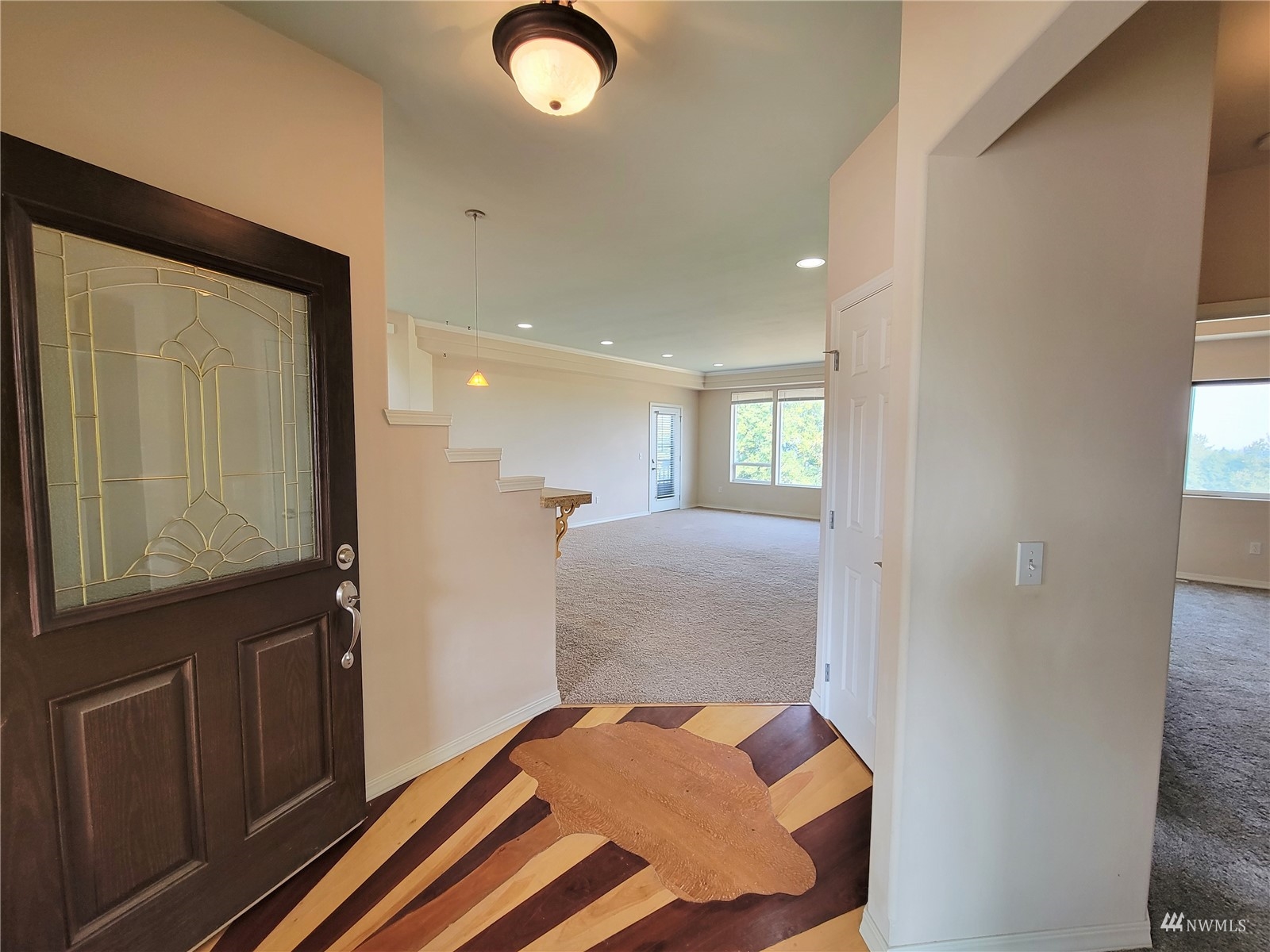 131 Les Saints Road Sequim, WA 98382 - Photo 6 of 32 a bedroom with a bed and a mirror