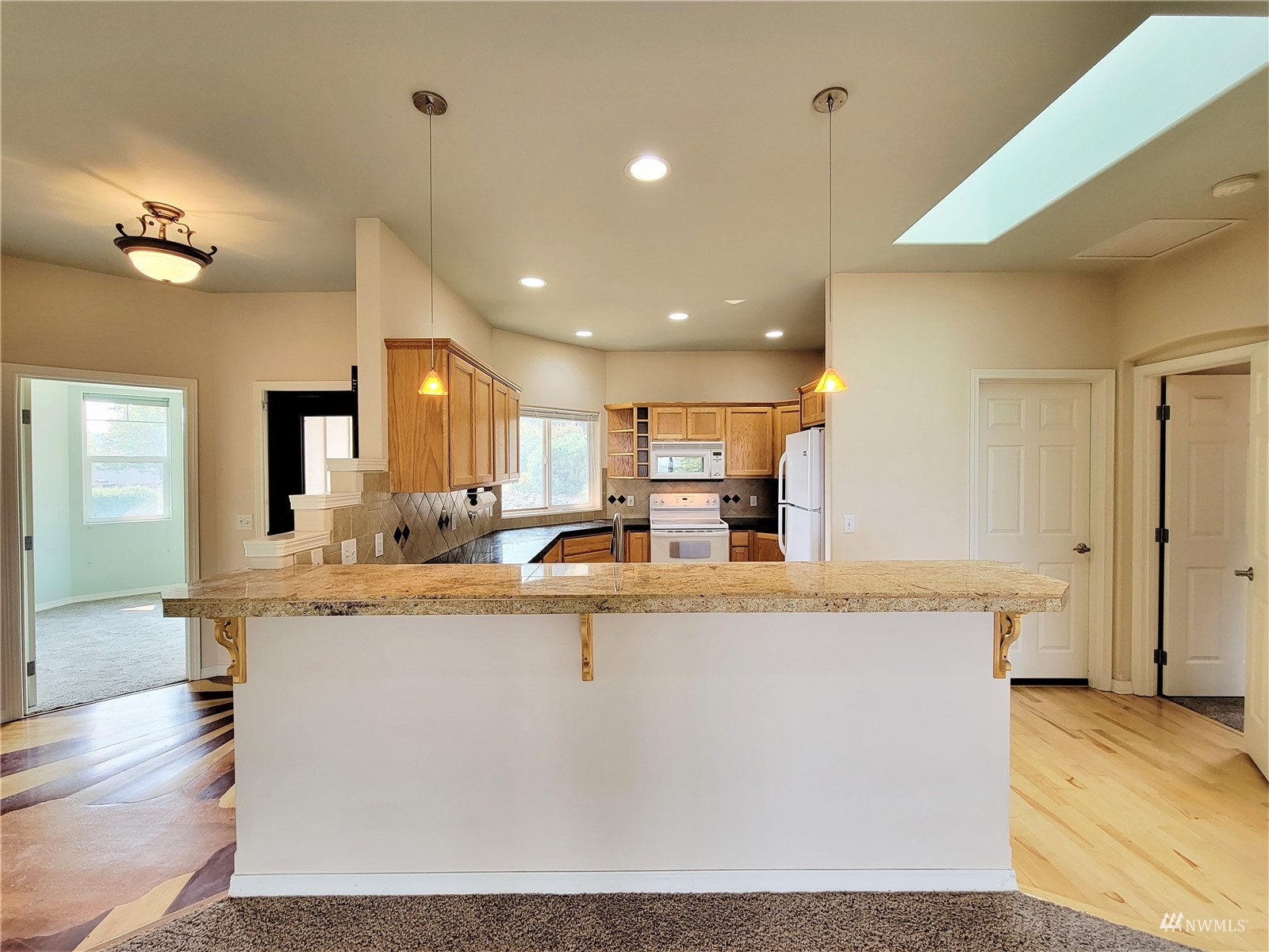 131 Les Saints Road Sequim, WA 98382 - Photo 8 of 32 a view of kitchen with stainless steel appliances granite countertop sink and a refrigerator