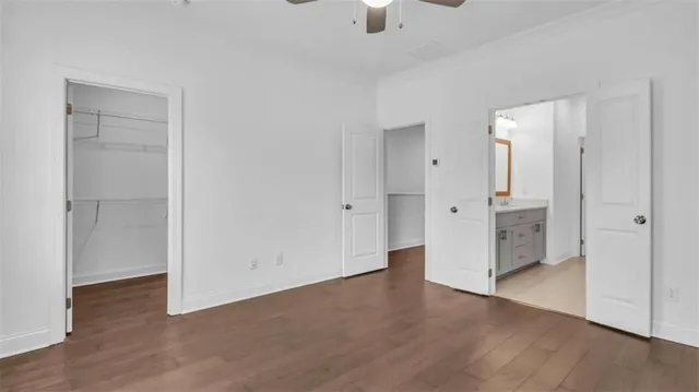 a bedroom with a bed and a flat screen television