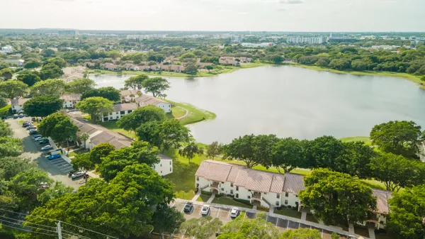 an aerial view of city and lake