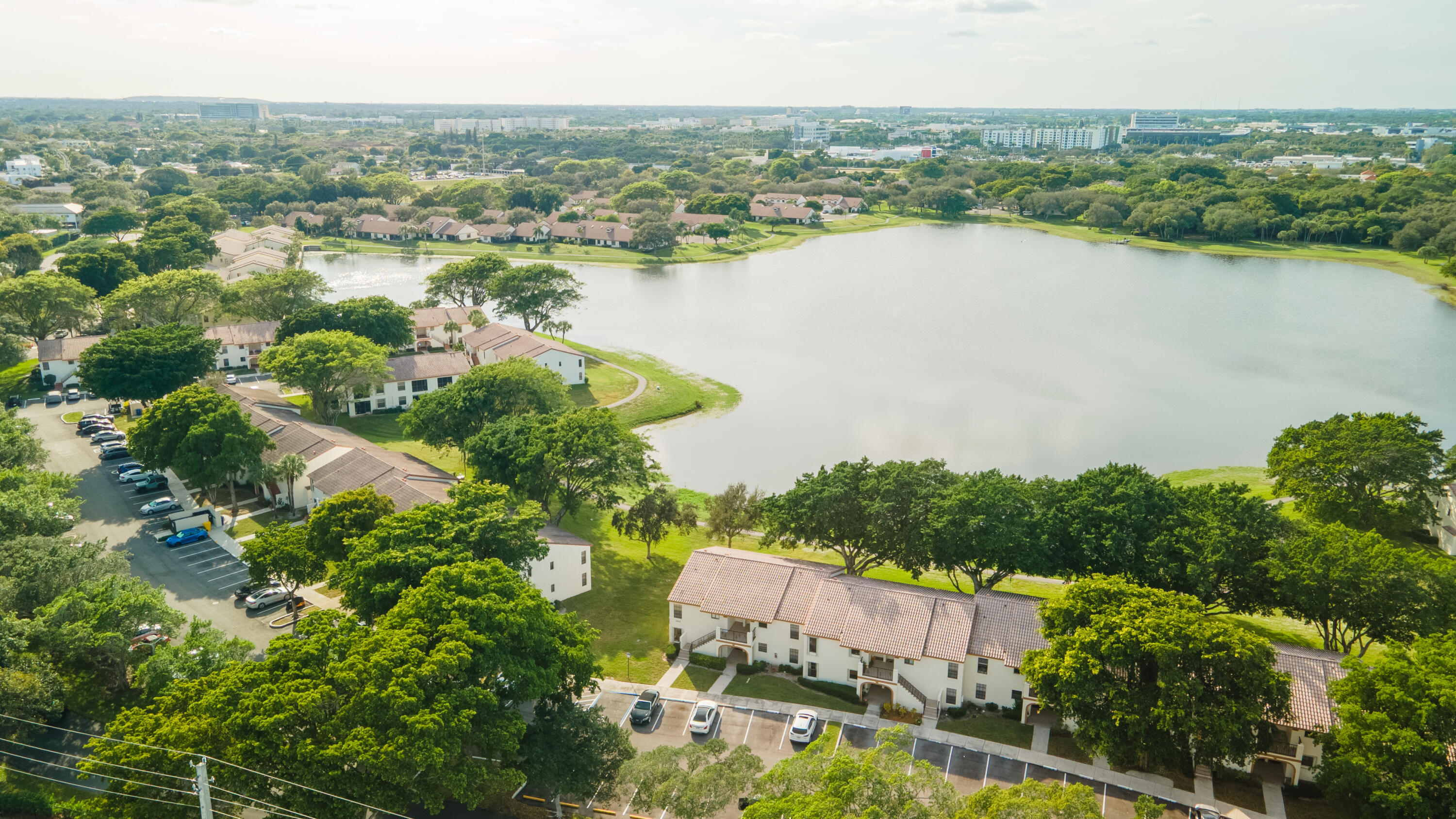 2900 Olivewood Terrace, Unit 2010 Boca Raton, FL 33431 - Photo 1 of 22 an aerial view of city and lake