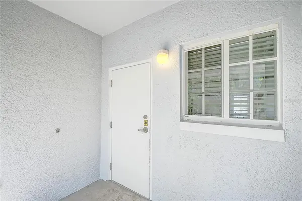 a view of an empty room with a window