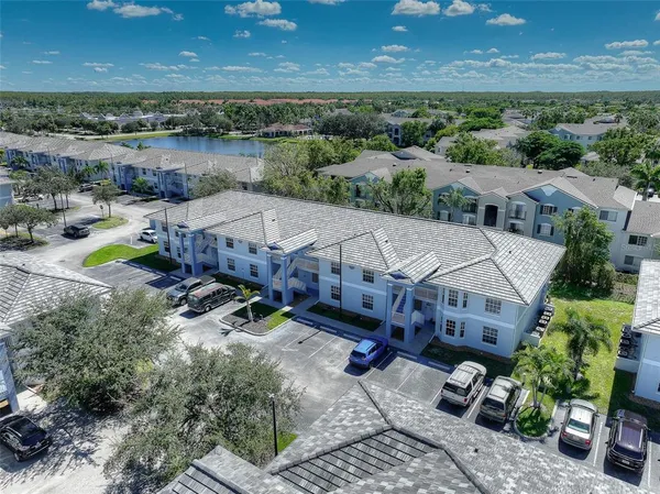 an aerial view of a house with a yard