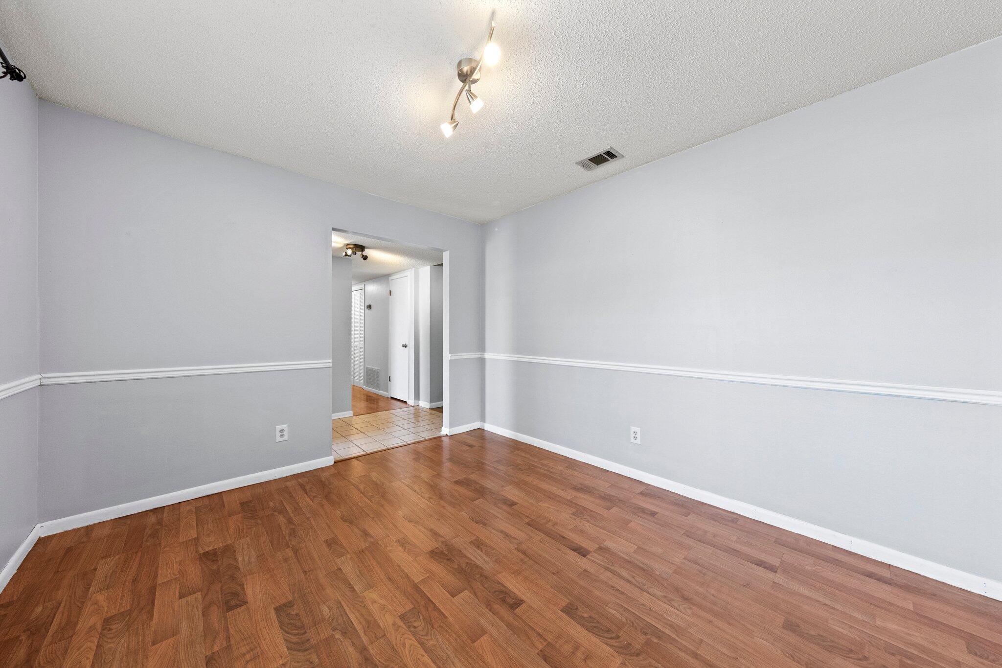 466 Olde Post Road Niceville, FL 32578 - Photo 15 of 49 a view of an empty room with wooden floor
