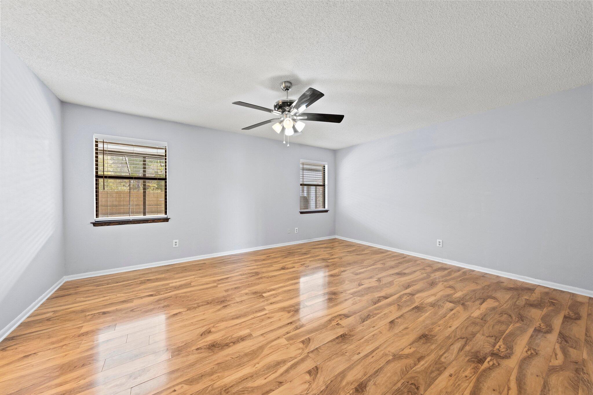 466 Olde Post Road Niceville, FL 32578 - Photo 17 of 49 a view of empty room with wooden floor