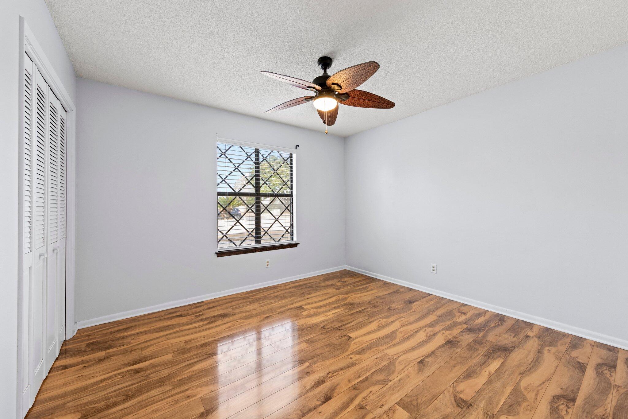 466 Olde Post Road Niceville, FL 32578 - Photo 23 of 49 a view of empty room with window and ceiling fan