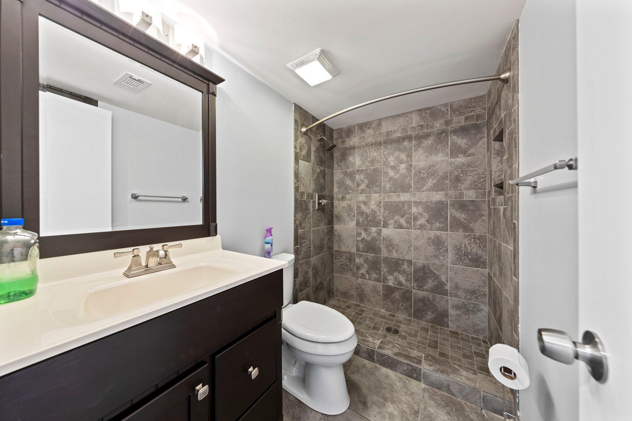 466 Olde Post Road Niceville, FL 32578 - Photo 25 of 49 a bathroom with a sink a toilet and shower