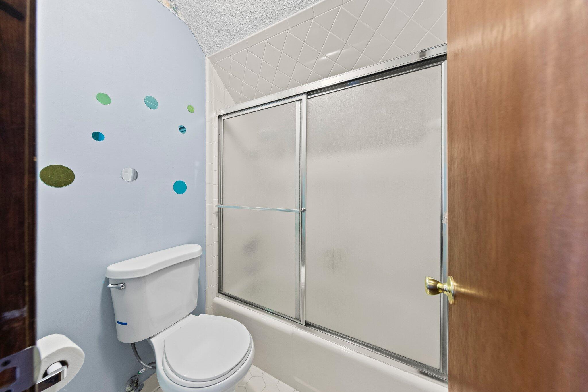 466 Olde Post Road Niceville, FL 32578 - Photo 32 of 49 a white toilet sitting next to a bathroom sink