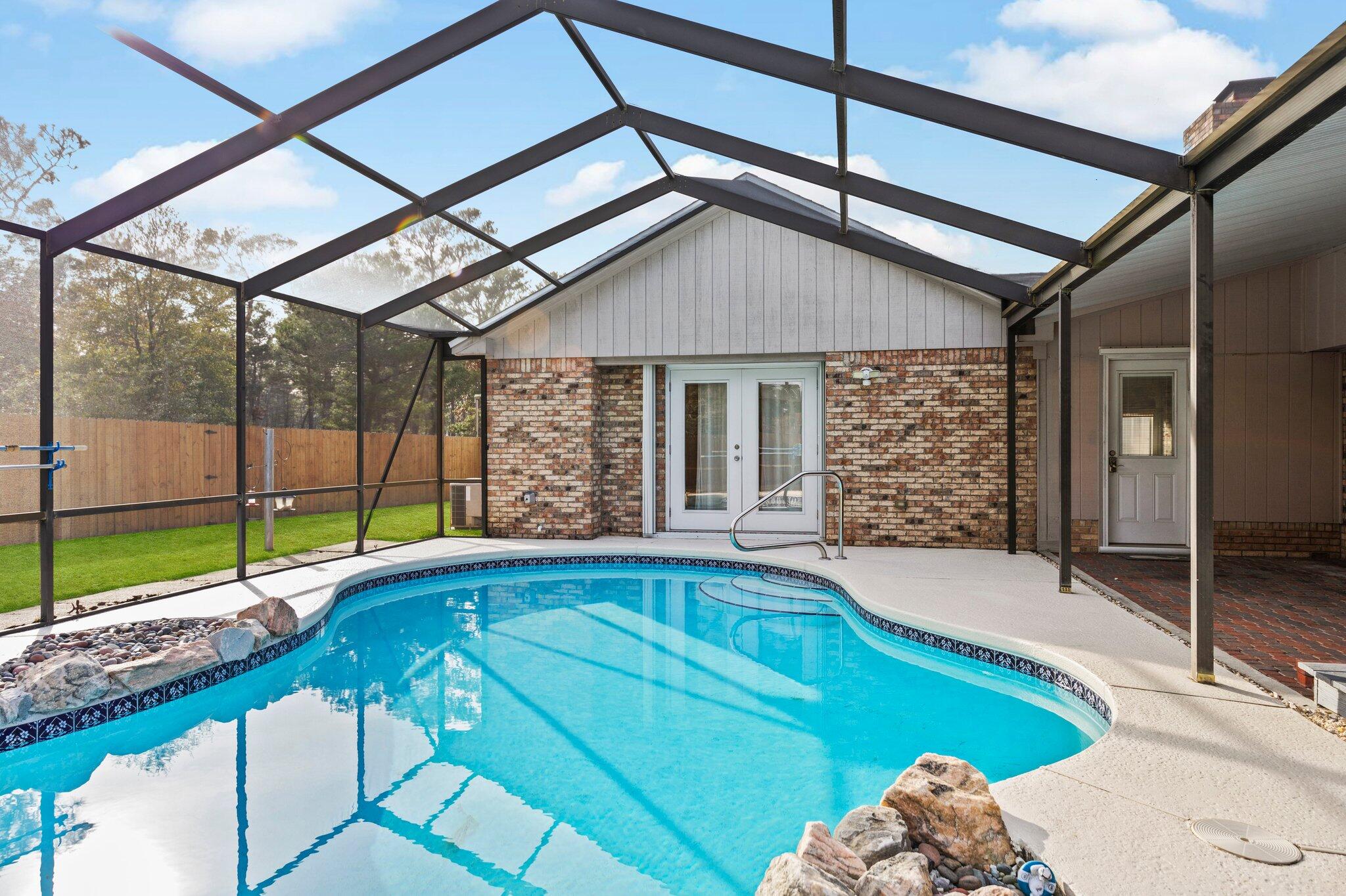 466 Olde Post Road Niceville, FL 32578 - Photo 41 of 49 a swimming pool with patio outdoor seating and yard