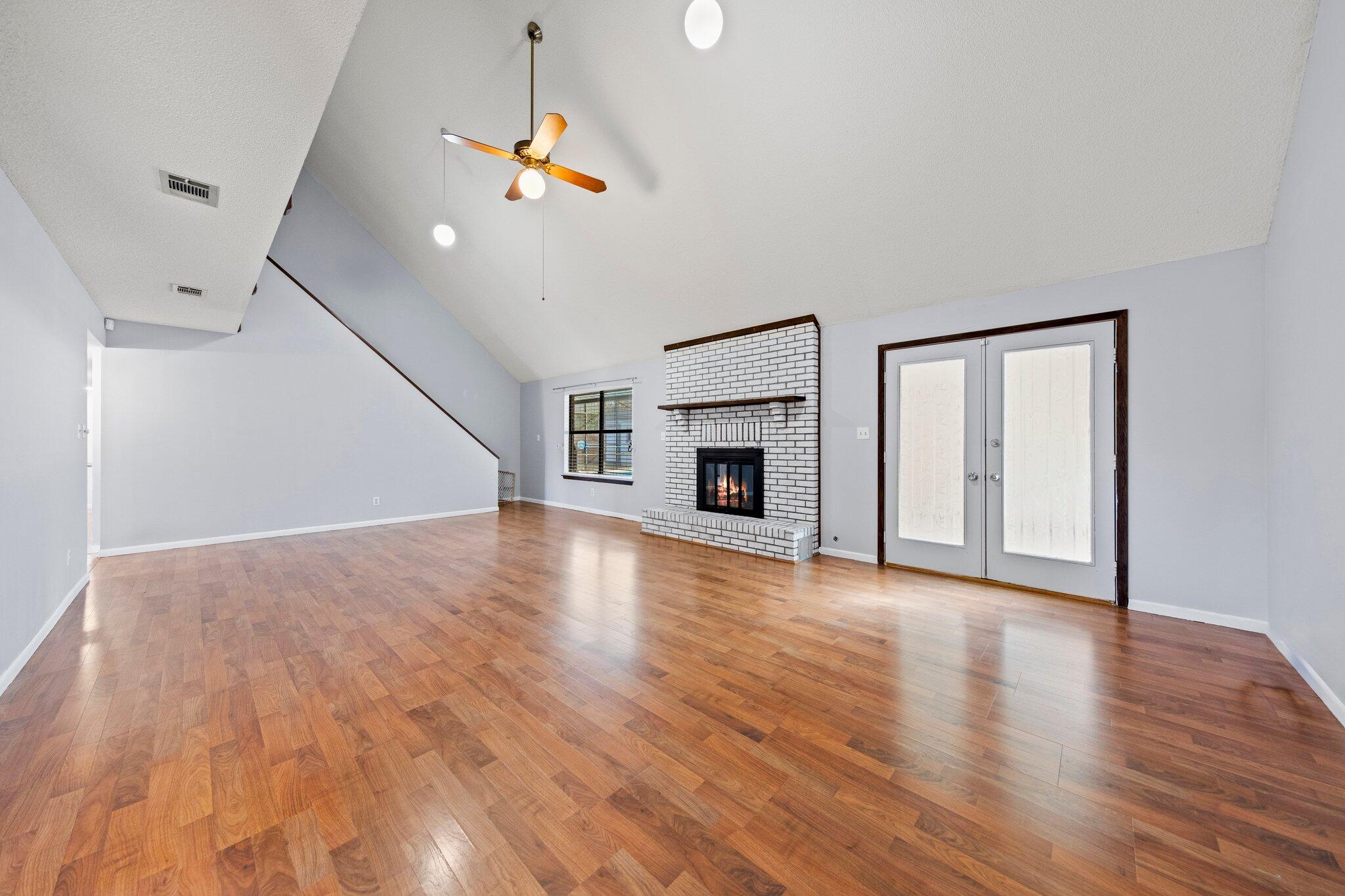 466 Olde Post Road Niceville, FL 32578 - Photo 5 of 49 a view of empty room with wooden floor and fireplace