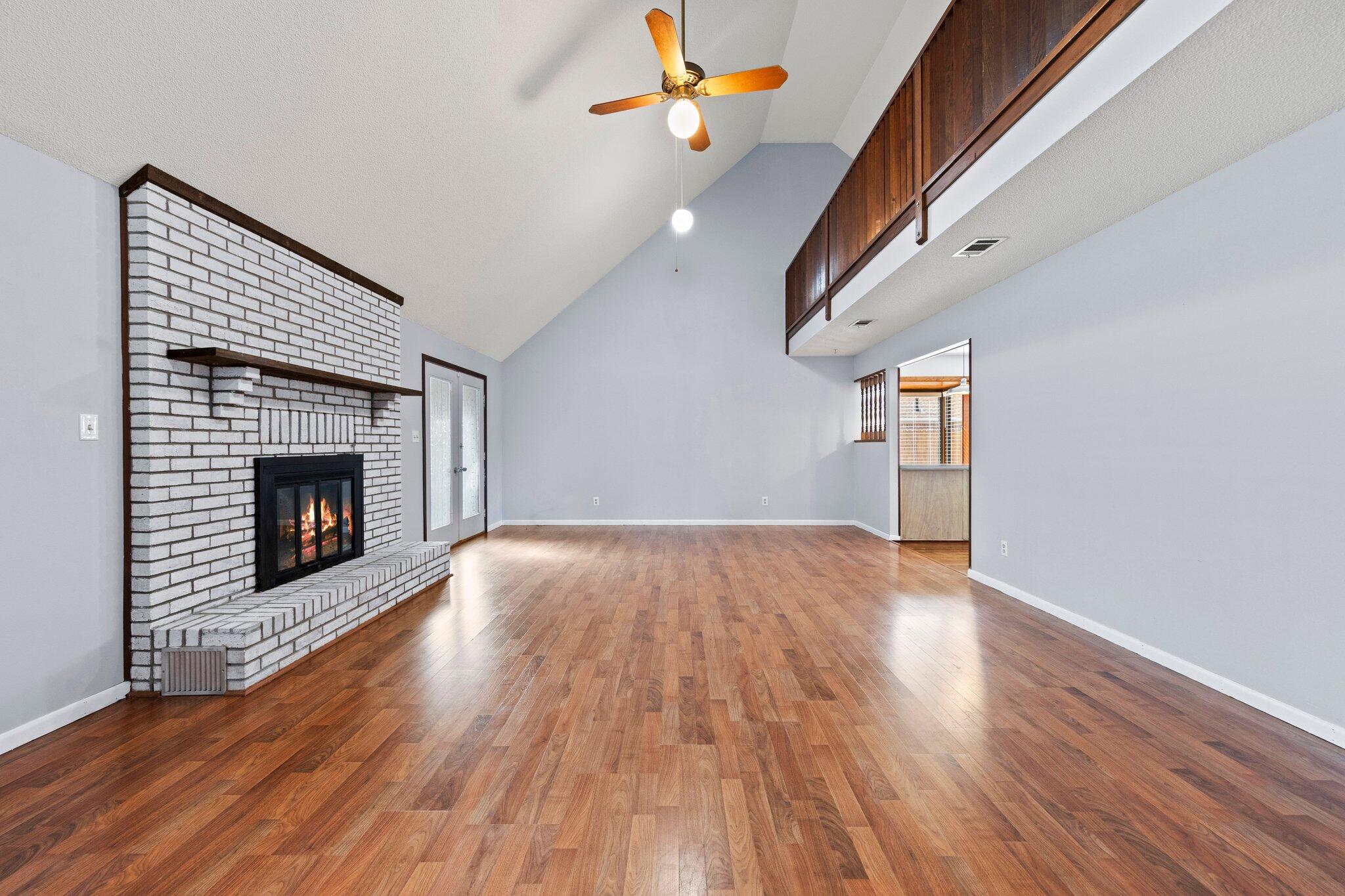 466 Olde Post Road Niceville, FL 32578 - Photo 8 of 49 a view of empty room with wooden floor and fireplace